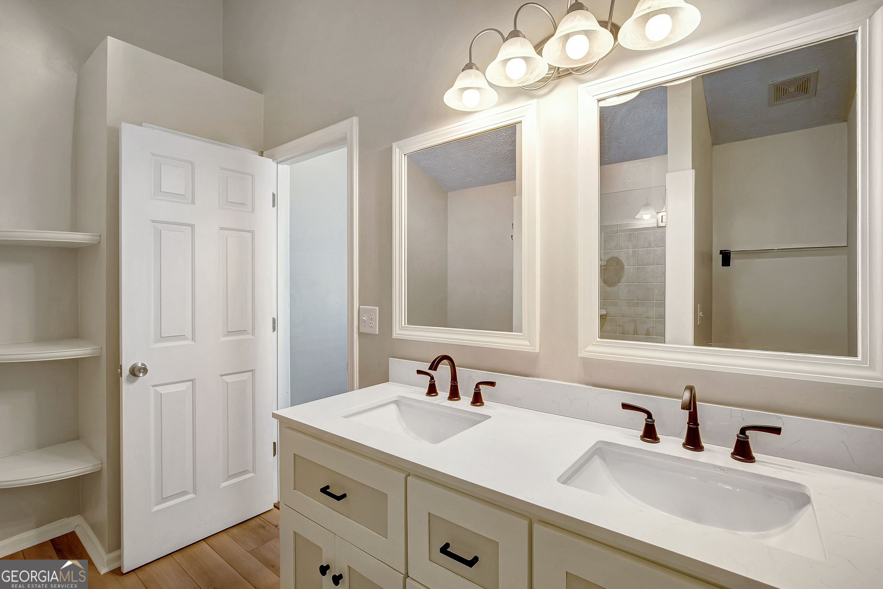 128 Lake Cove Approach Newnan, GA 30265 - Photo 41 of 63 a bathroom with a sink and a mirror