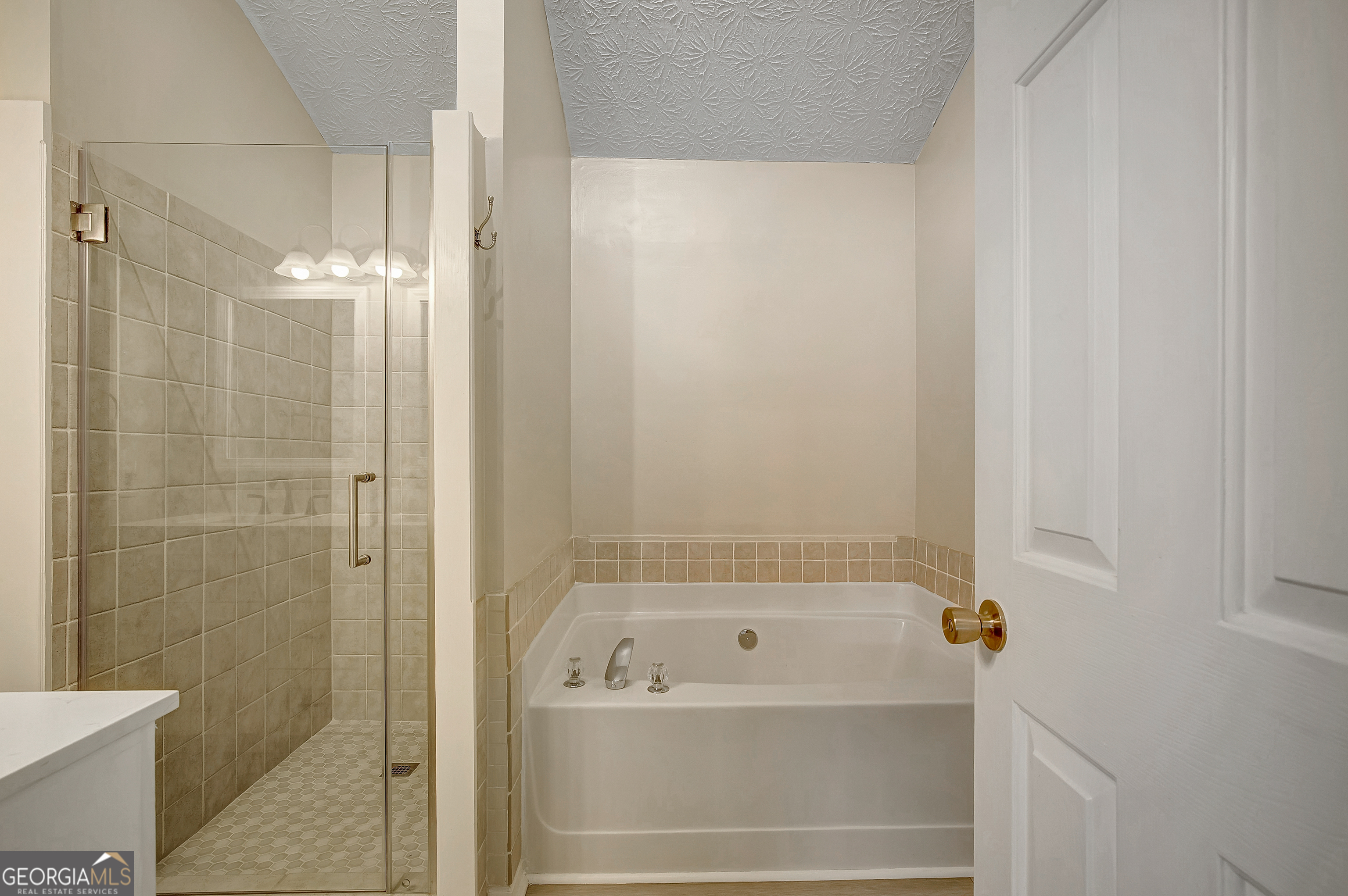 128 Lake Cove Approach Newnan, GA 30265 - Photo 43 of 63 a bathroom with a bathtub and a shower