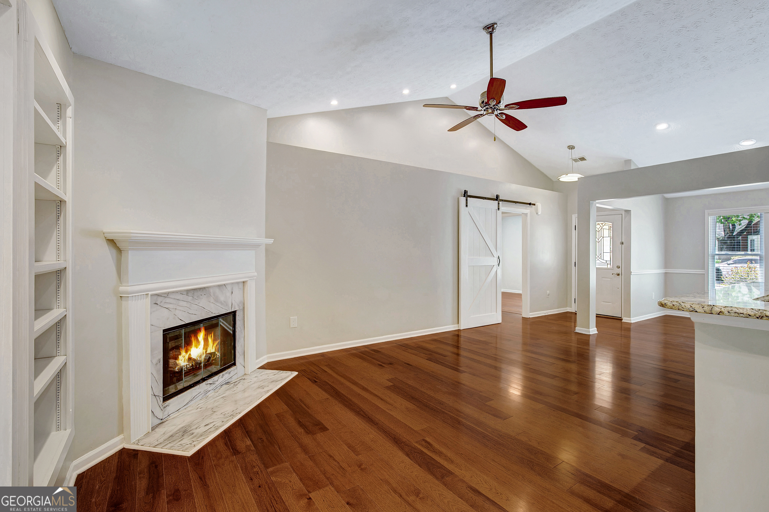 128 Lake Cove Approach Newnan, GA 30265 - Photo 45 of 63 a view of an empty room with window and fireplace
