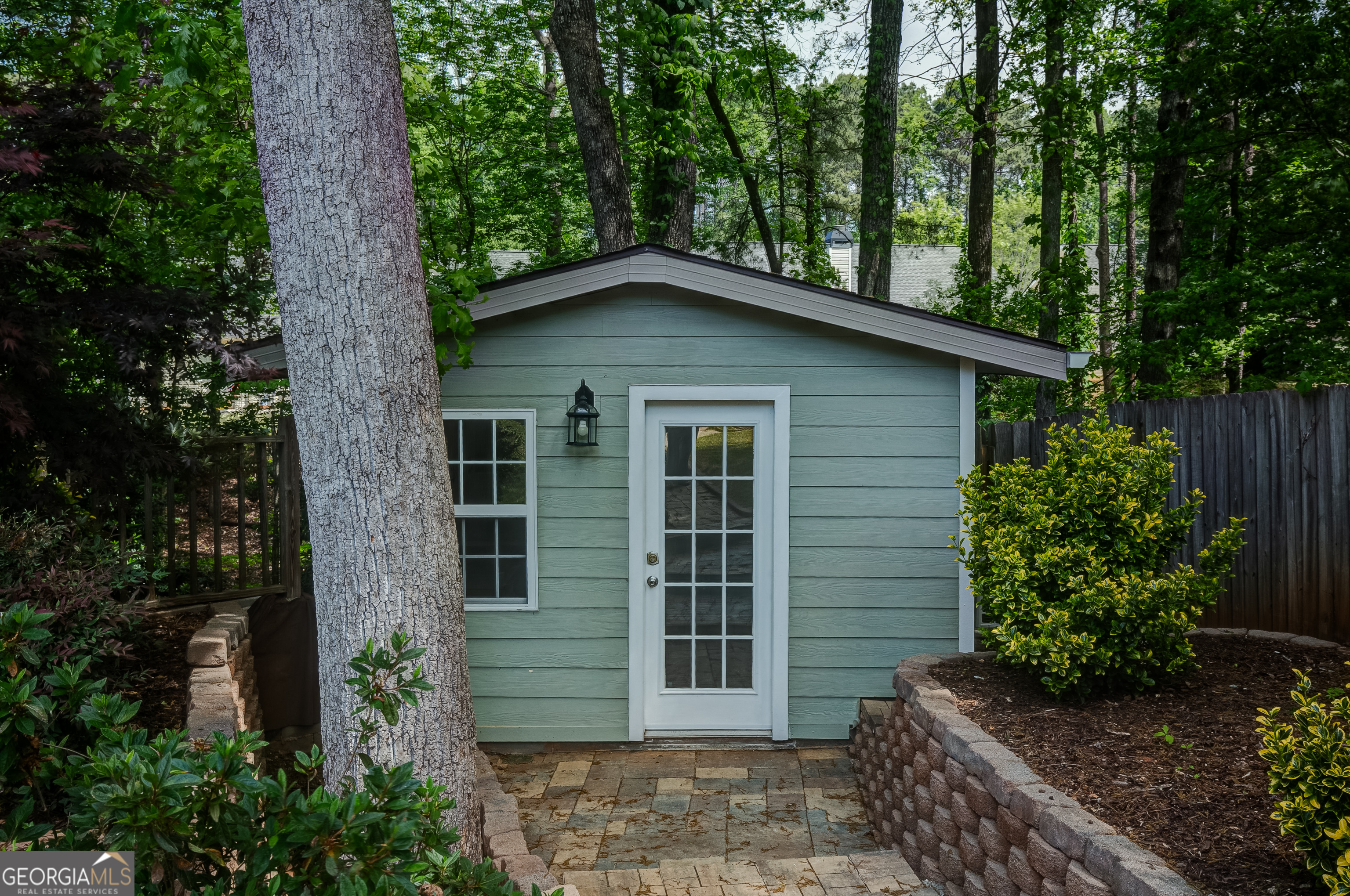 128 Lake Cove Approach Newnan, GA 30265 - Photo 55 of 63 a house with a tree in the background