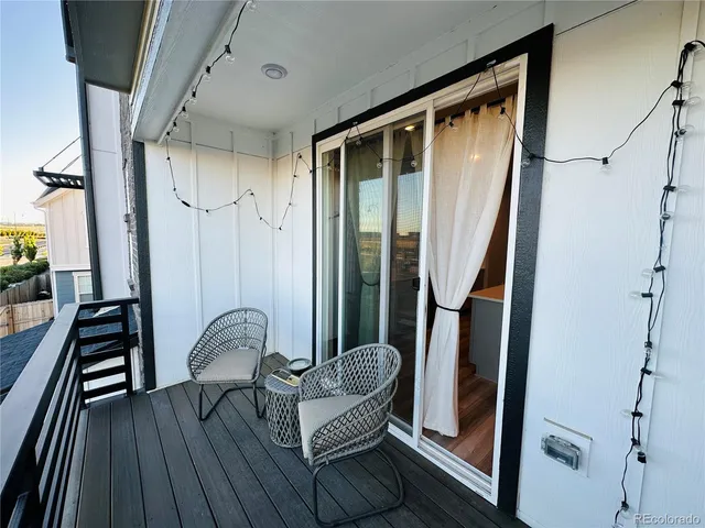 a view of a balcony with furniture