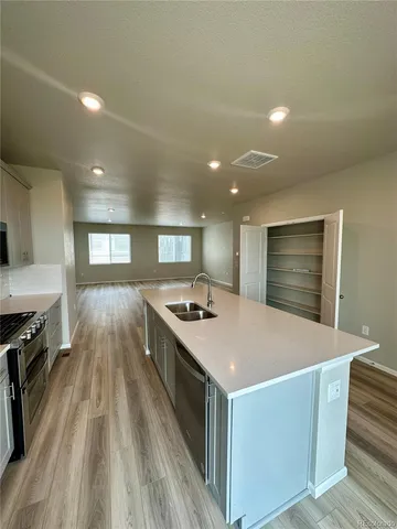 a kitchen with a stove and a kitchen island
