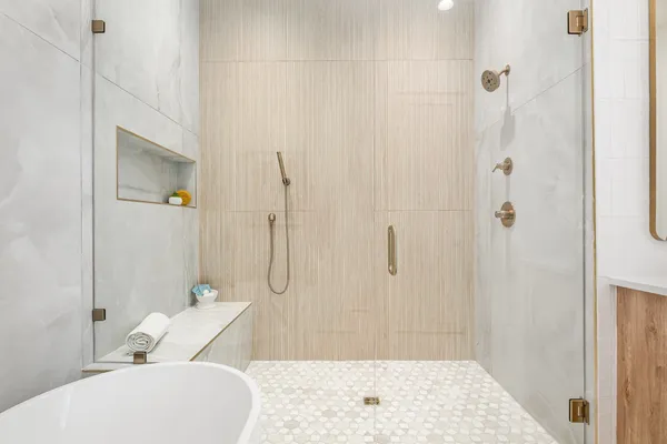 a bathroom with a sink a toilet and shower