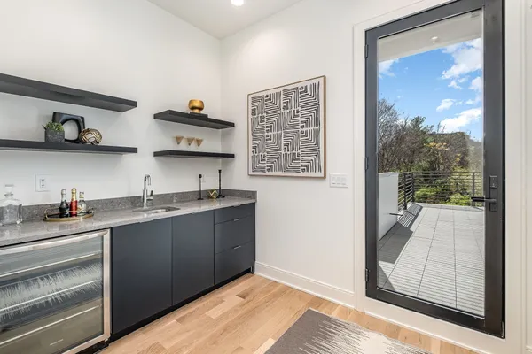 a kitchen with stainless steel appliances granite countertop a sink and wooden cabinets