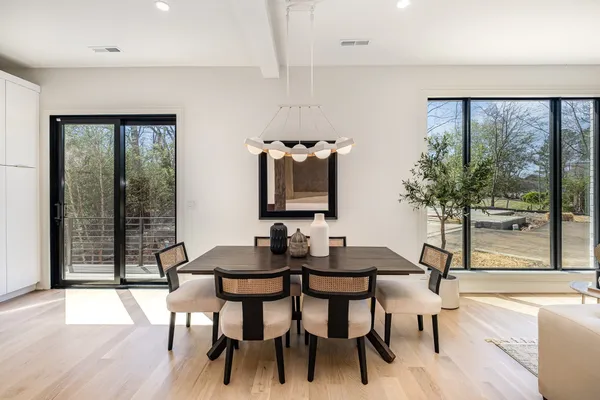 a view of a dining room with furniture and window