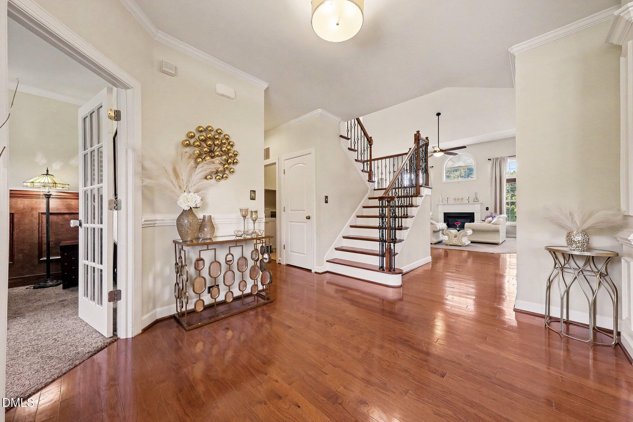 4000 Banks Stone Drive Raleigh, NC 27603 - Photo 14 of 60 a view of entryway with livingroom and wooden floor