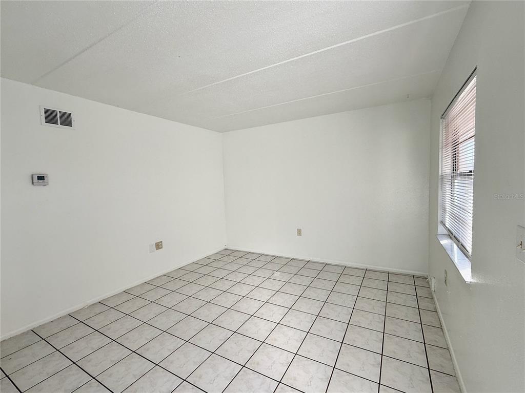 716 Michigan Court, Unit 2 St. Cloud, FL 34769 - Photo 6 of 17 a view of an empty room