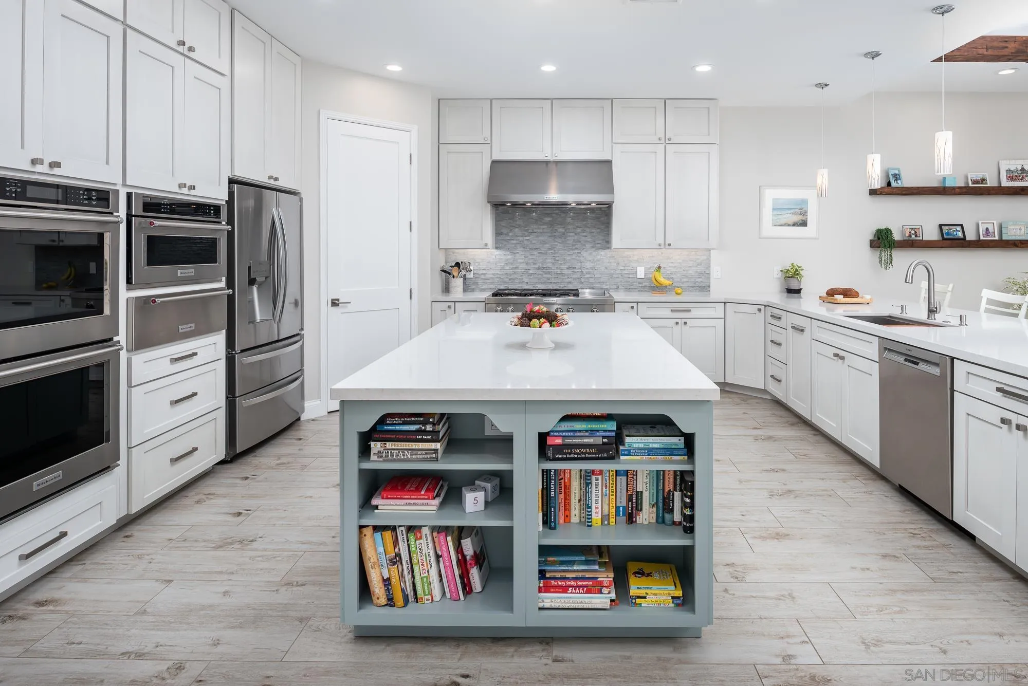1060 Pine Street Coronado, CA 92118 - Photo 16 of 36 a large kitchen with stainless steel appliances and a kitchen island