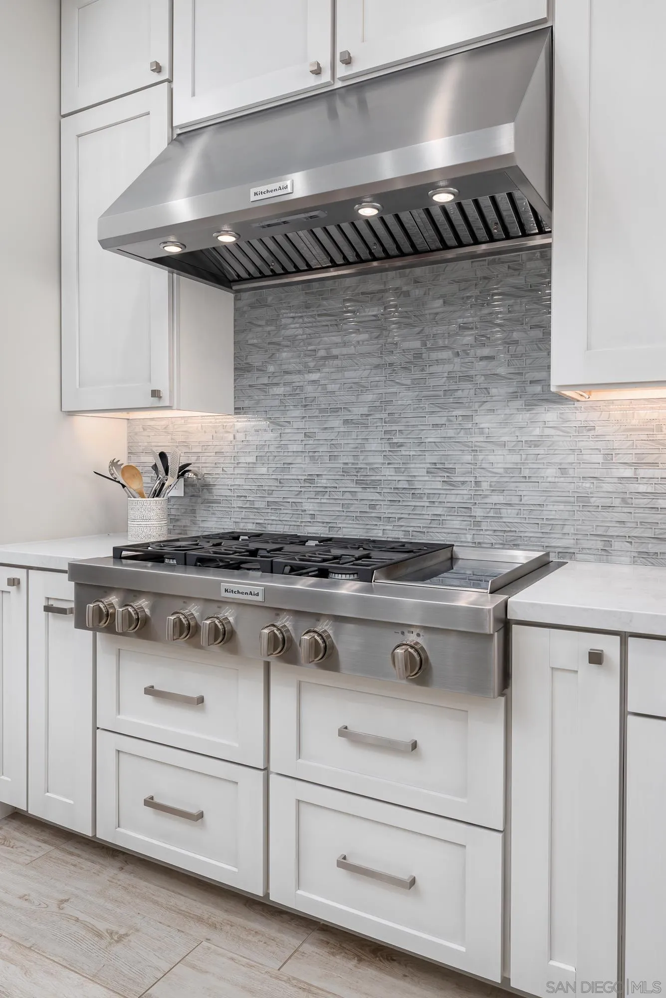 1060 Pine Street Coronado, CA 92118 - Photo 17 of 36 a stove top oven sitting inside of a kitchen