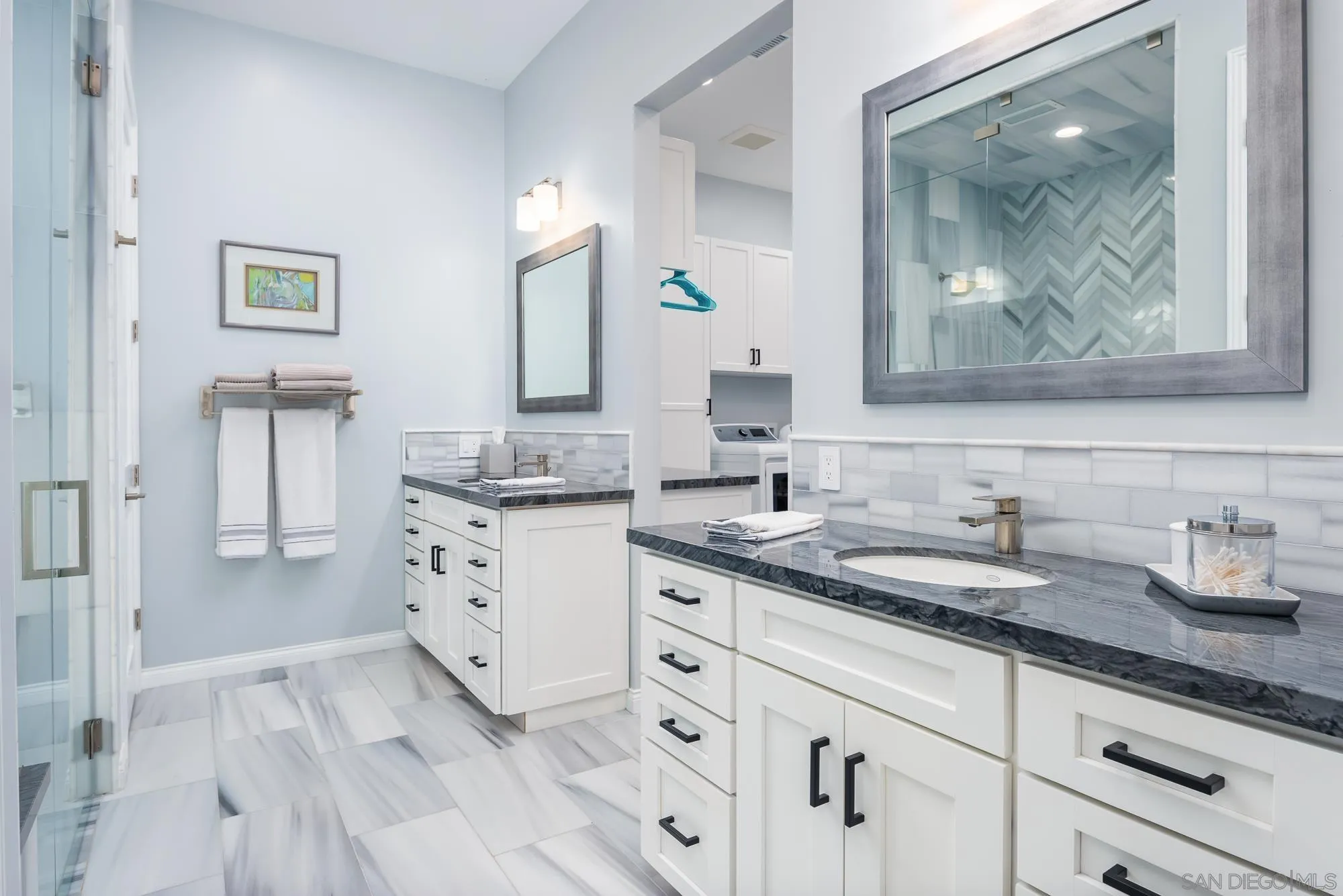 1060 Pine Street Coronado, CA 92118 - Photo 21 of 36 a bathroom with double vanity sink and mirror
