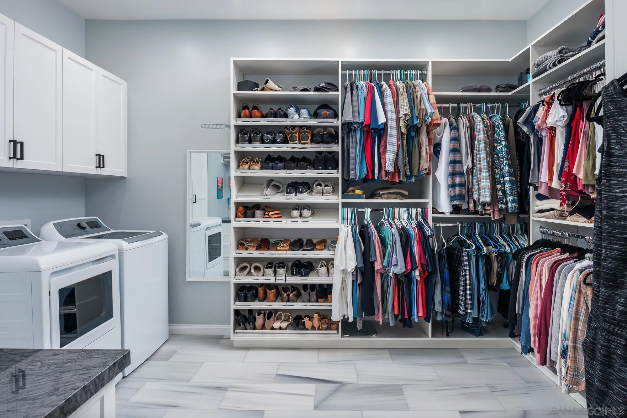 1060 Pine Street Coronado, CA 92118 - Photo 23 of 36 a view of walk in closet with clothes