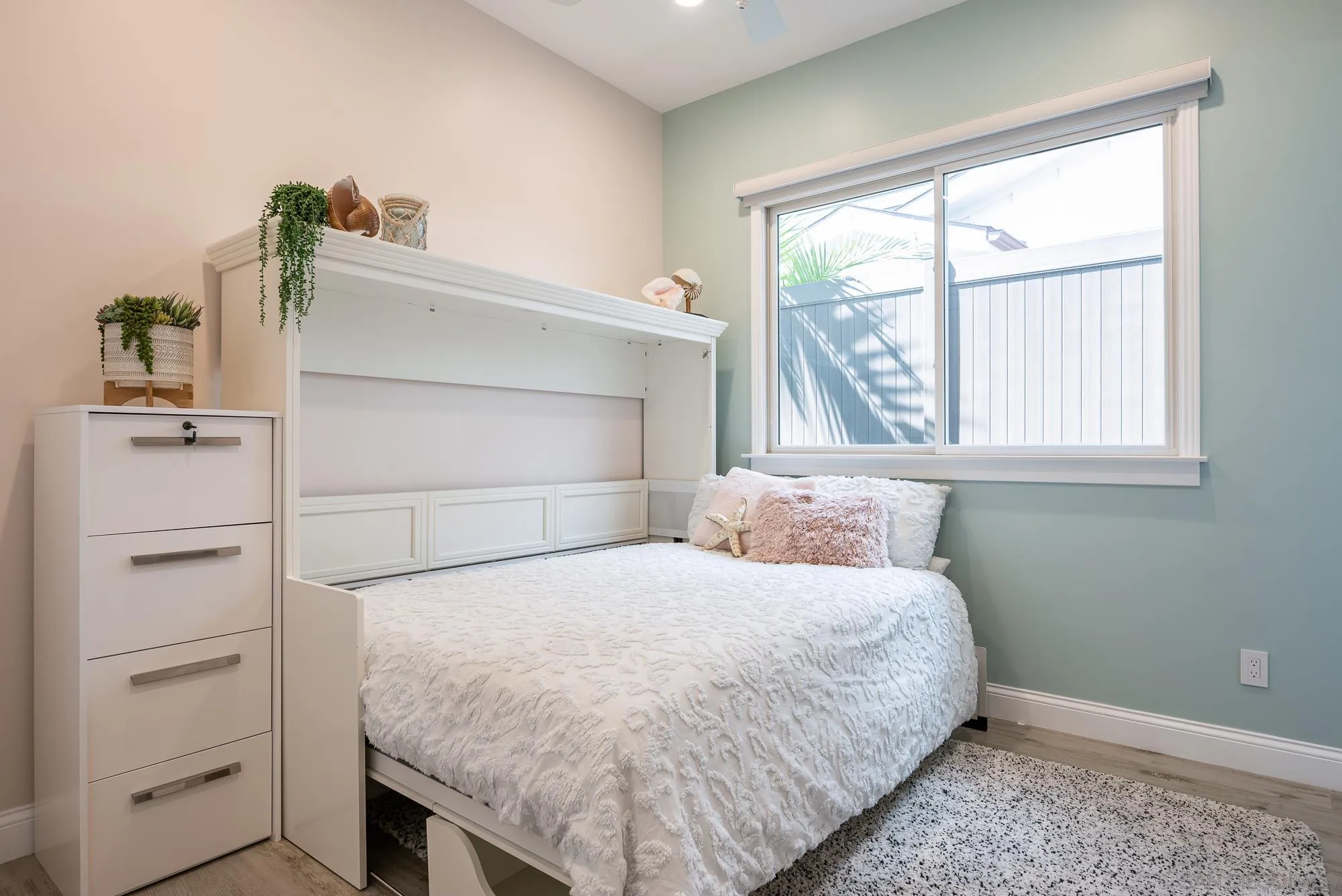 1060 Pine Street Coronado, CA 92118 - Photo 24 of 36 a bedroom with a bed and a window