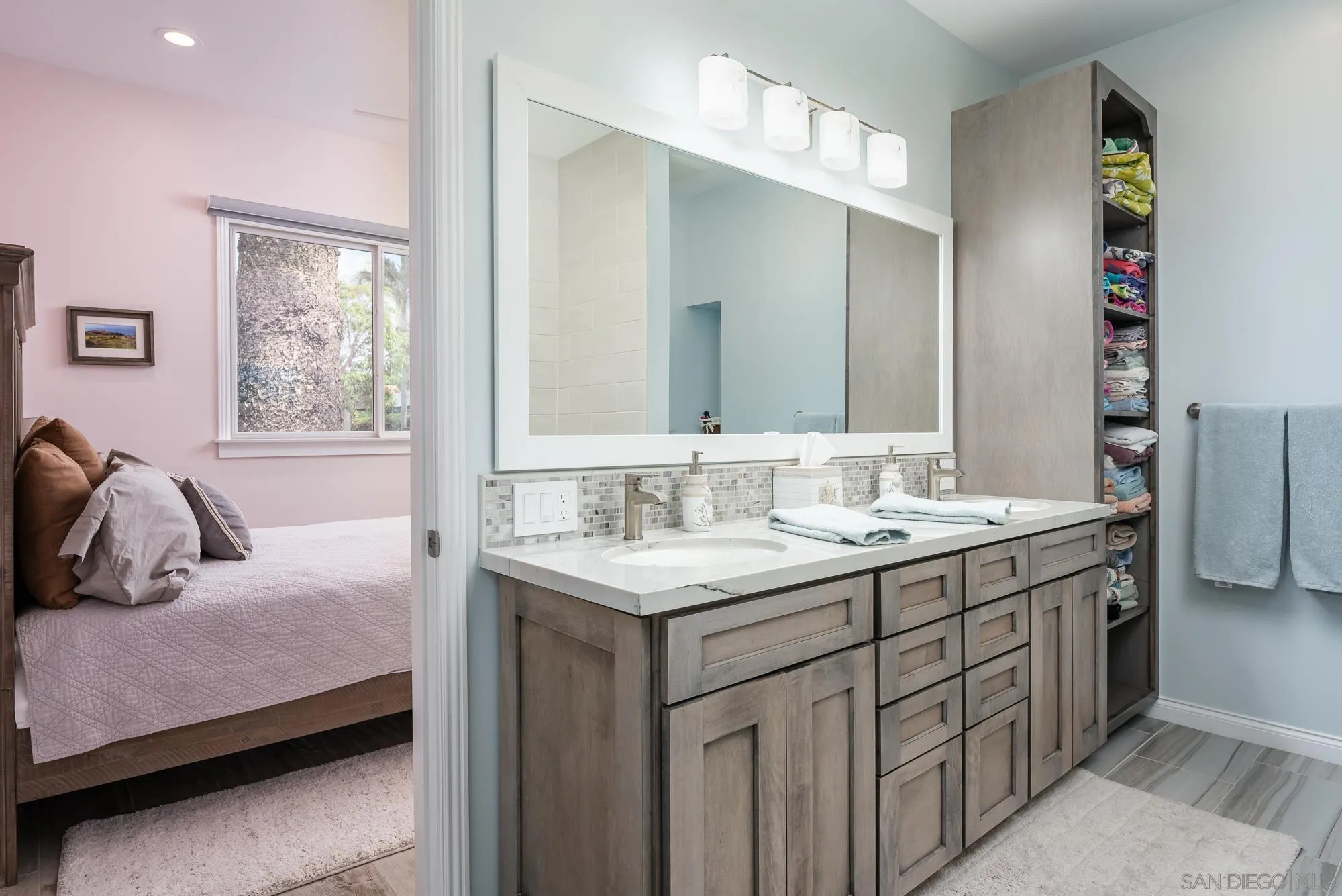 1060 Pine Street Coronado, CA 92118 - Photo 26 of 36 a en suite bathroom with a double vanity sink and a mirror