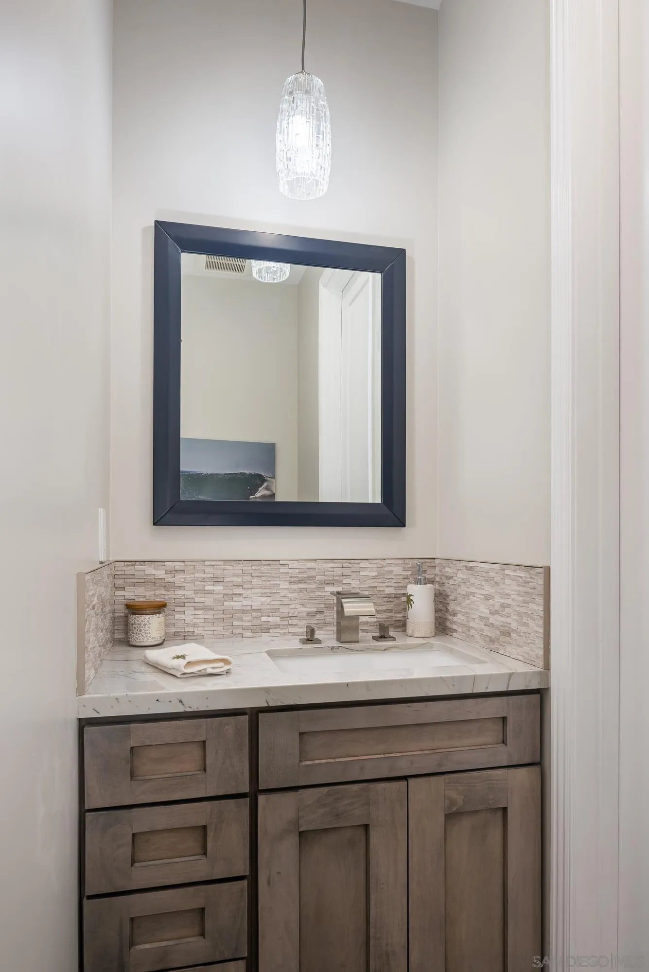 1060 Pine Street Coronado, CA 92118 - Photo 28 of 36 a bathroom with a sink and a mirror