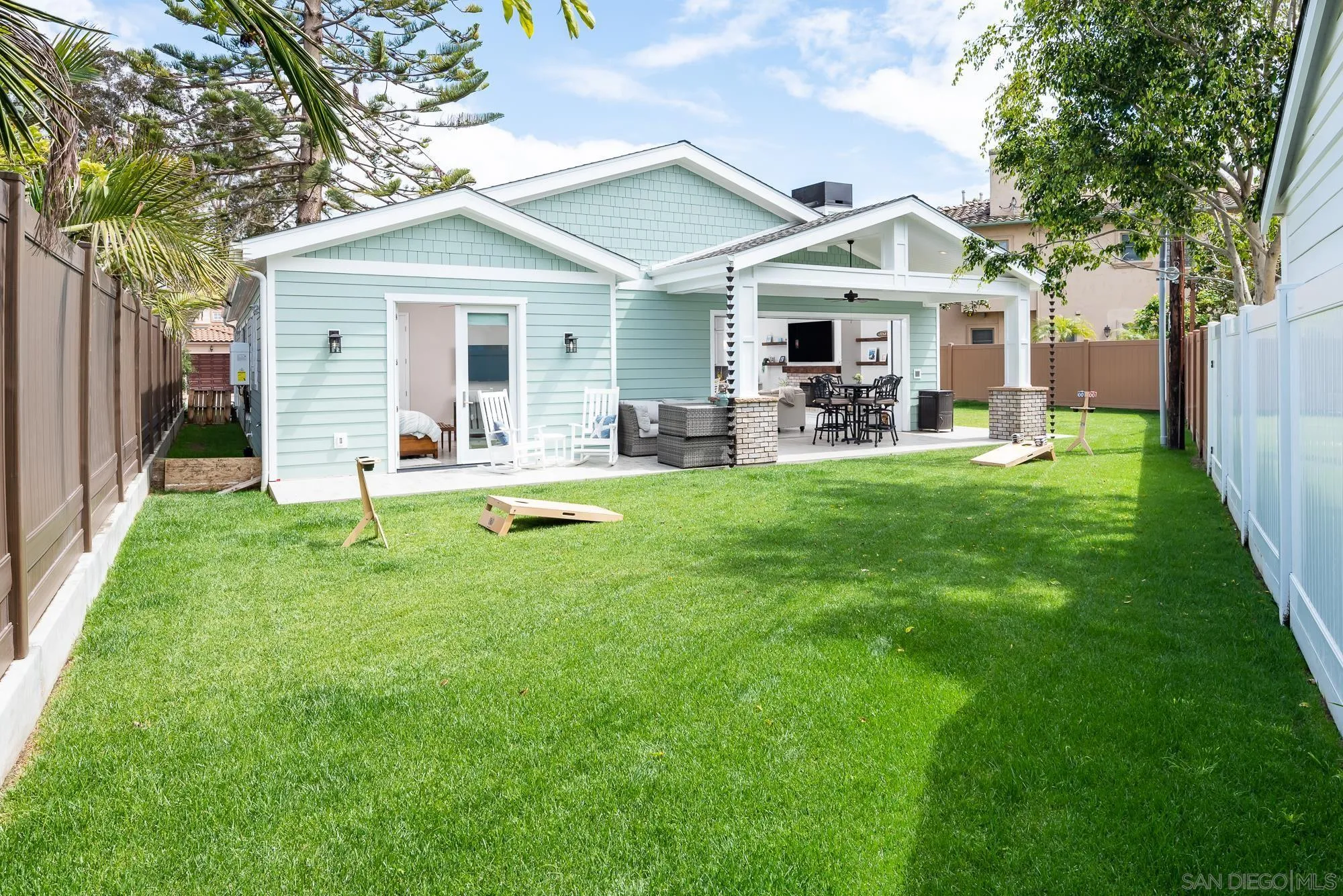 1060 Pine Street Coronado, CA 92118 - Photo 30 of 36 a front view of a house with a garden and trees