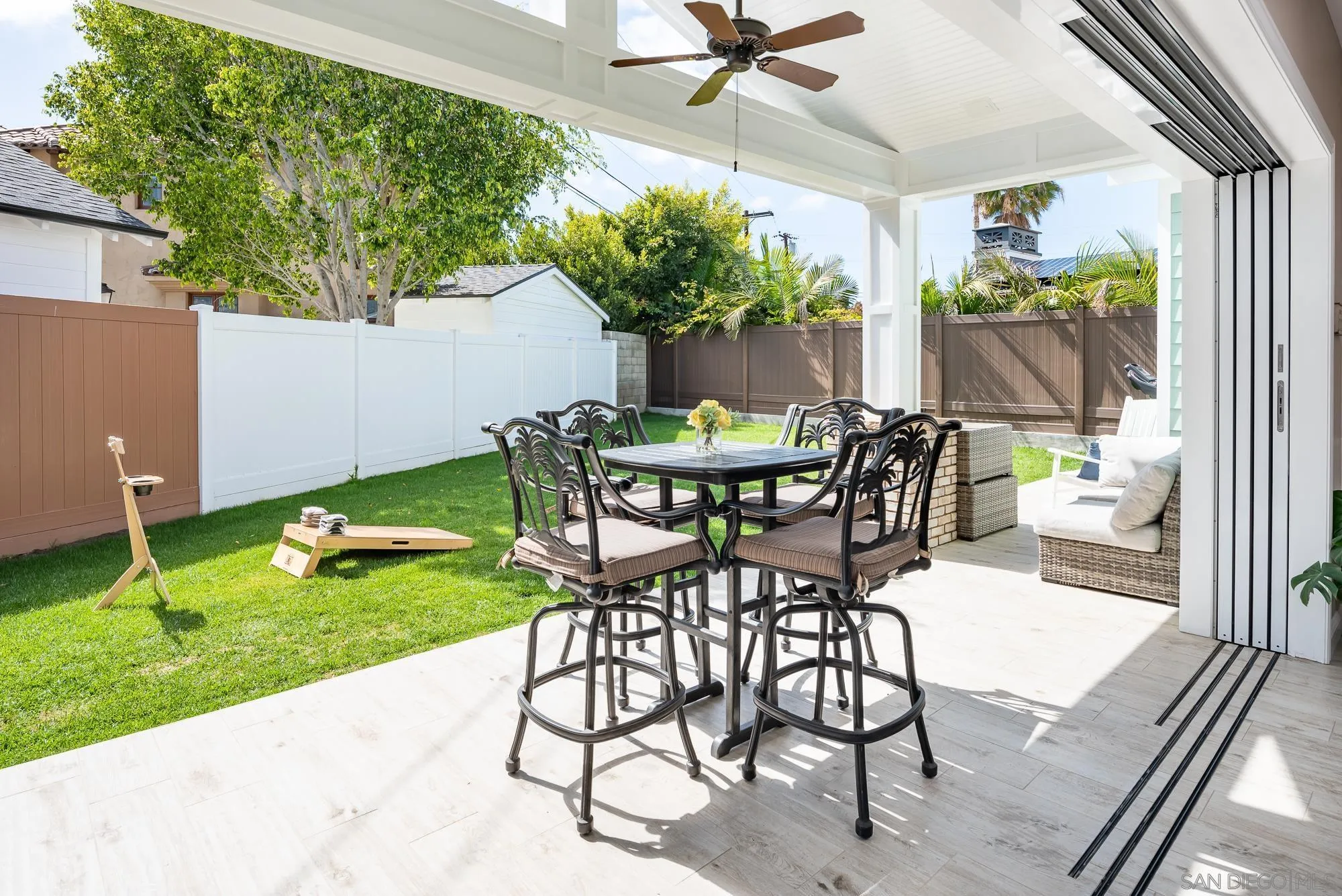 1060 Pine Street Coronado, CA 92118 - Photo 32 of 36 a view of a backyard with a dining table and chairs