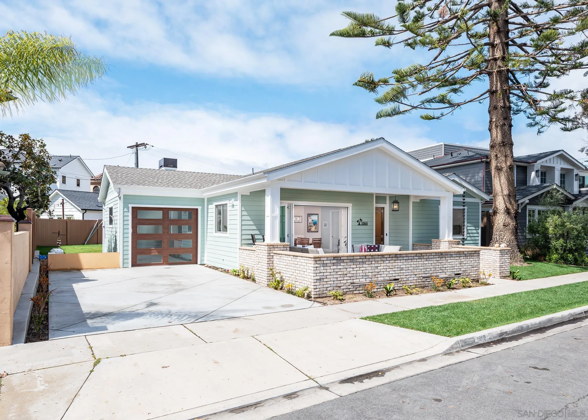 1060 Pine Street Coronado, CA 92118 - Photo 34 of 36 a front view of house with yard outdoor seating and barbeque oven