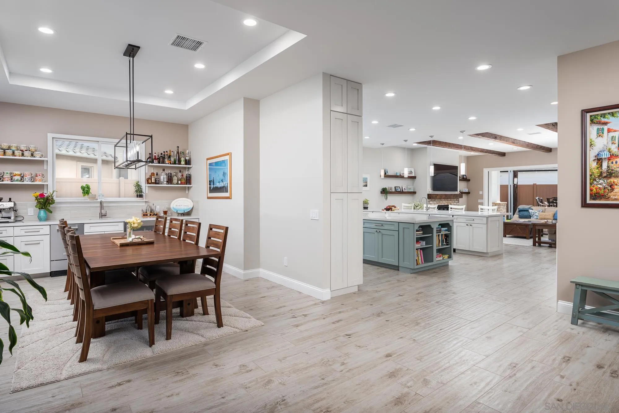 1060 Pine Street Coronado, CA 92118 - Photo 7 of 36 a kitchen with stainless steel appliances kitchen island granite countertop a table chairs and a refrigerator