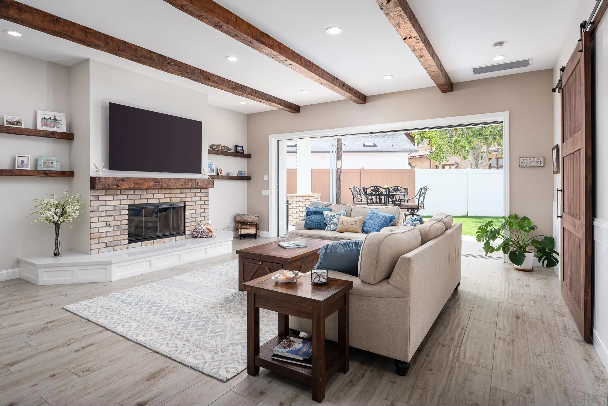 1060 Pine Street Coronado, CA 92118 - Photo 10 of 36 a living room with furniture a flat screen tv and a fireplace