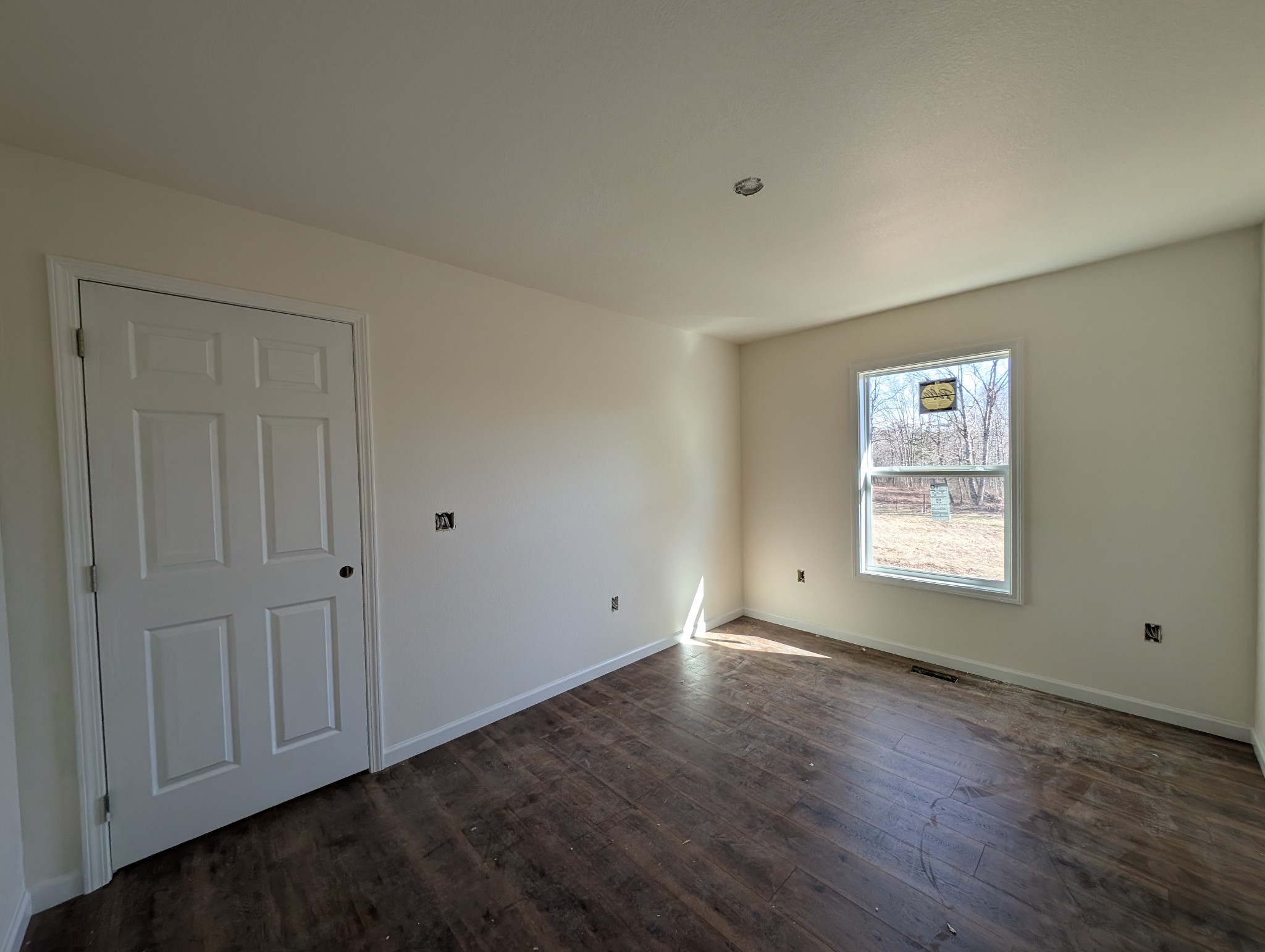 2771 Banner-Roslin Road Jamestown, TN 38556 - Photo 39 of 55 a view of an empty room with wooden floor and a window