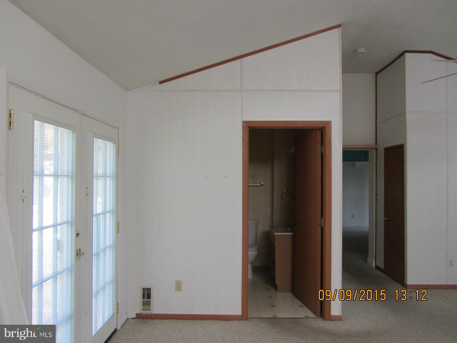38451 Bayview Road Coltons Point, MD 20626 - Photo 12 of 30 a view of a small space with wooden floor and a window