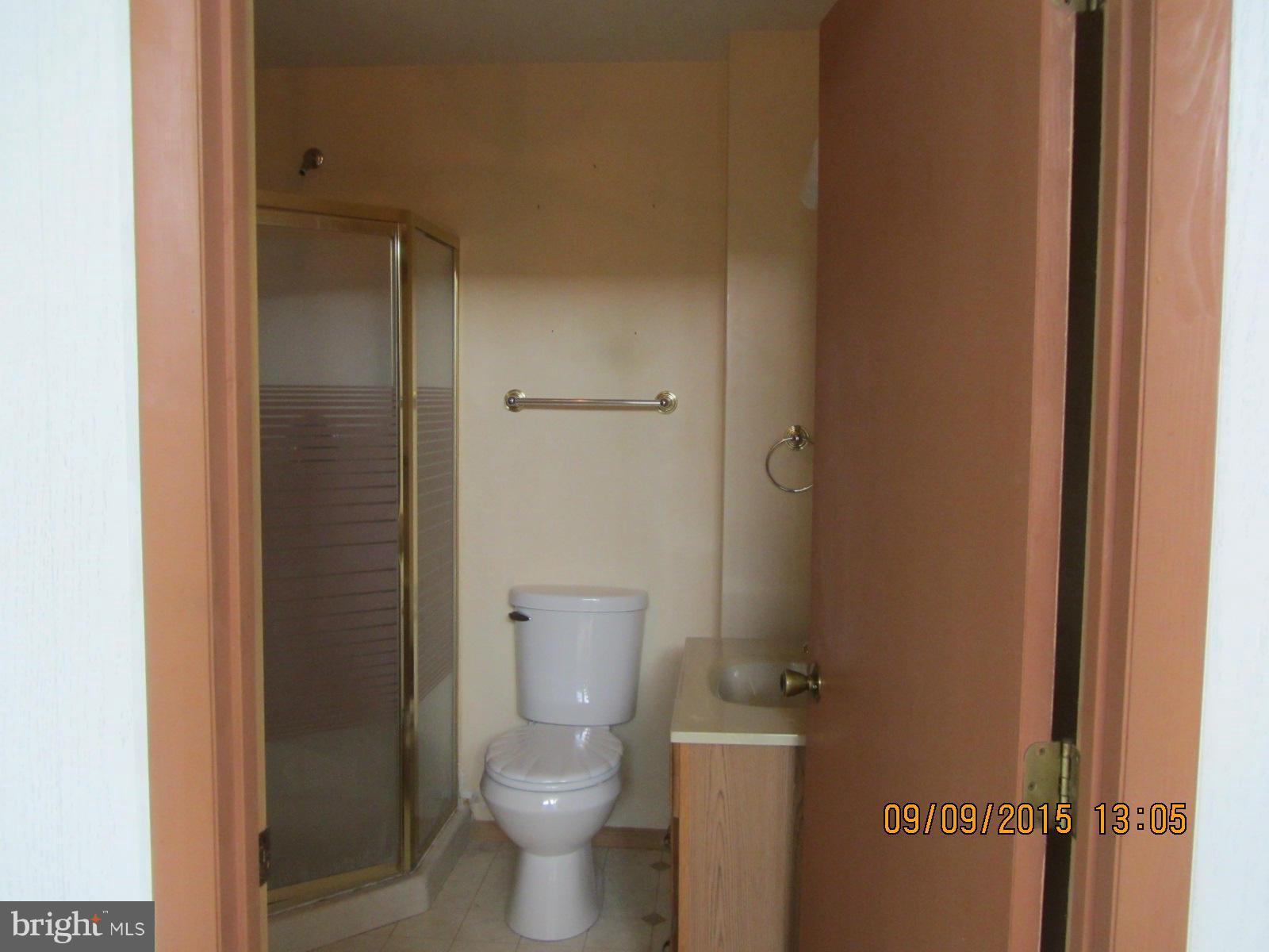 38451 Bayview Road Coltons Point, MD 20626 - Photo 14 of 30 a bathroom with a granite countertop toilet and a sink