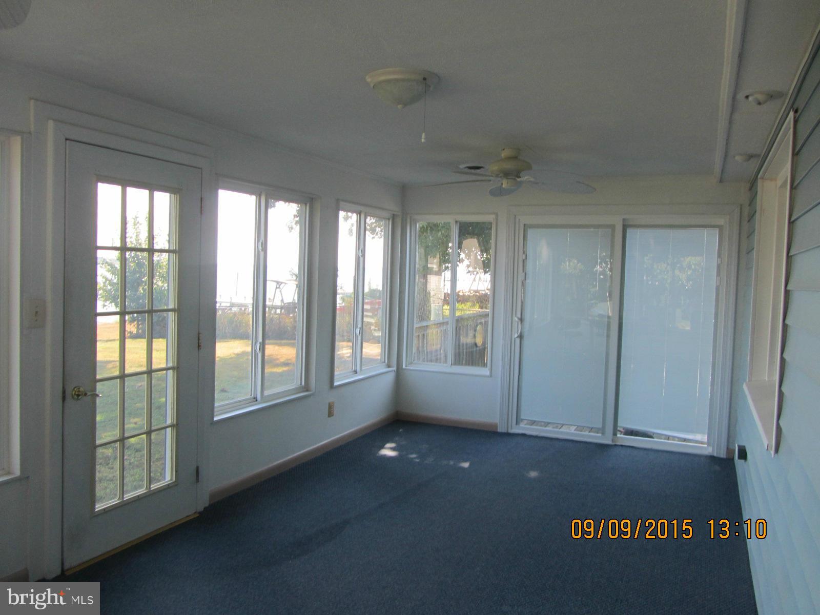 38451 Bayview Road Coltons Point, MD 20626 - Photo 17 of 30 a view of empty room with floor to ceiling windows