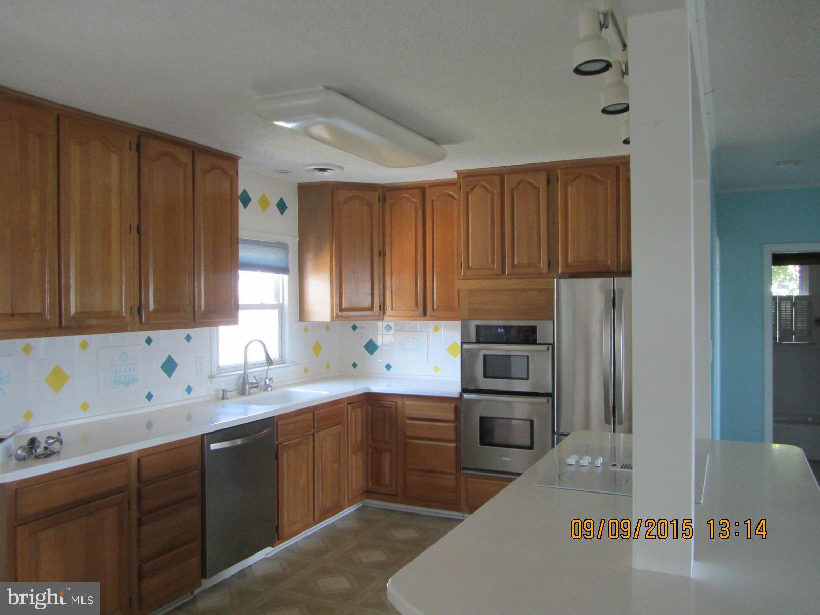 38451 Bayview Road Coltons Point, MD 20626 - Photo 4 of 30 a kitchen with stainless steel appliances granite countertop a refrigerator sink and cabinets