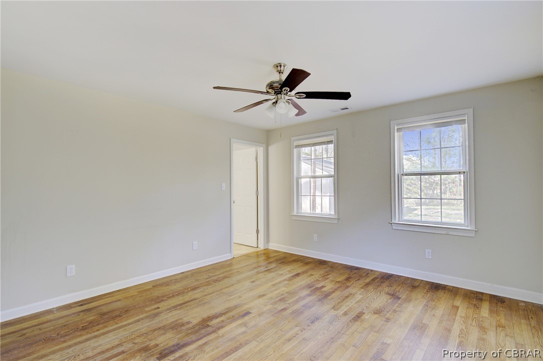 5347 Ware Neck Road Gloucester, VA 23061 - Photo 14 of 36 Unfurnished room featuring ceiling fan and light hardwood / wood-style flooring