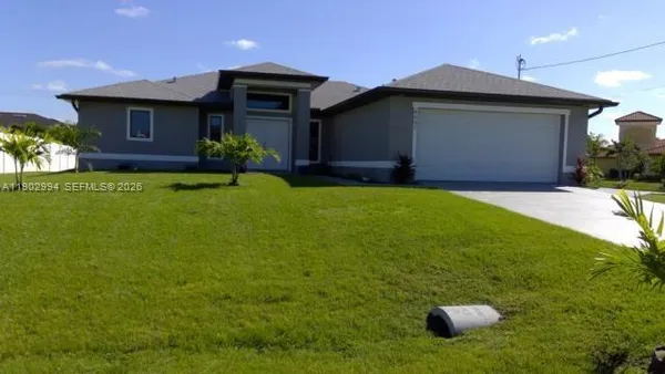 a front view of a house with yard