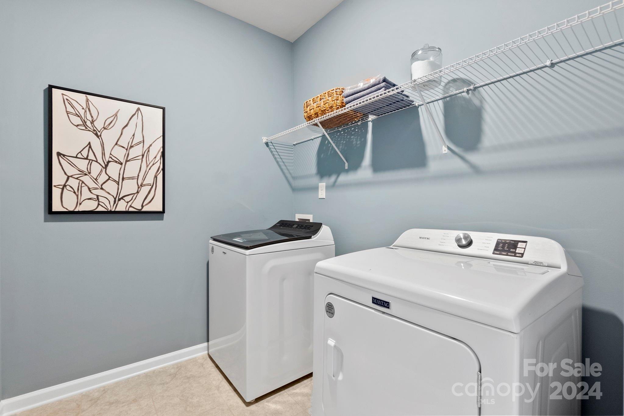 7864 Nelson Road Mint Hill, NC 28227 - Photo 16 of 45 a utility room with dryer and washer