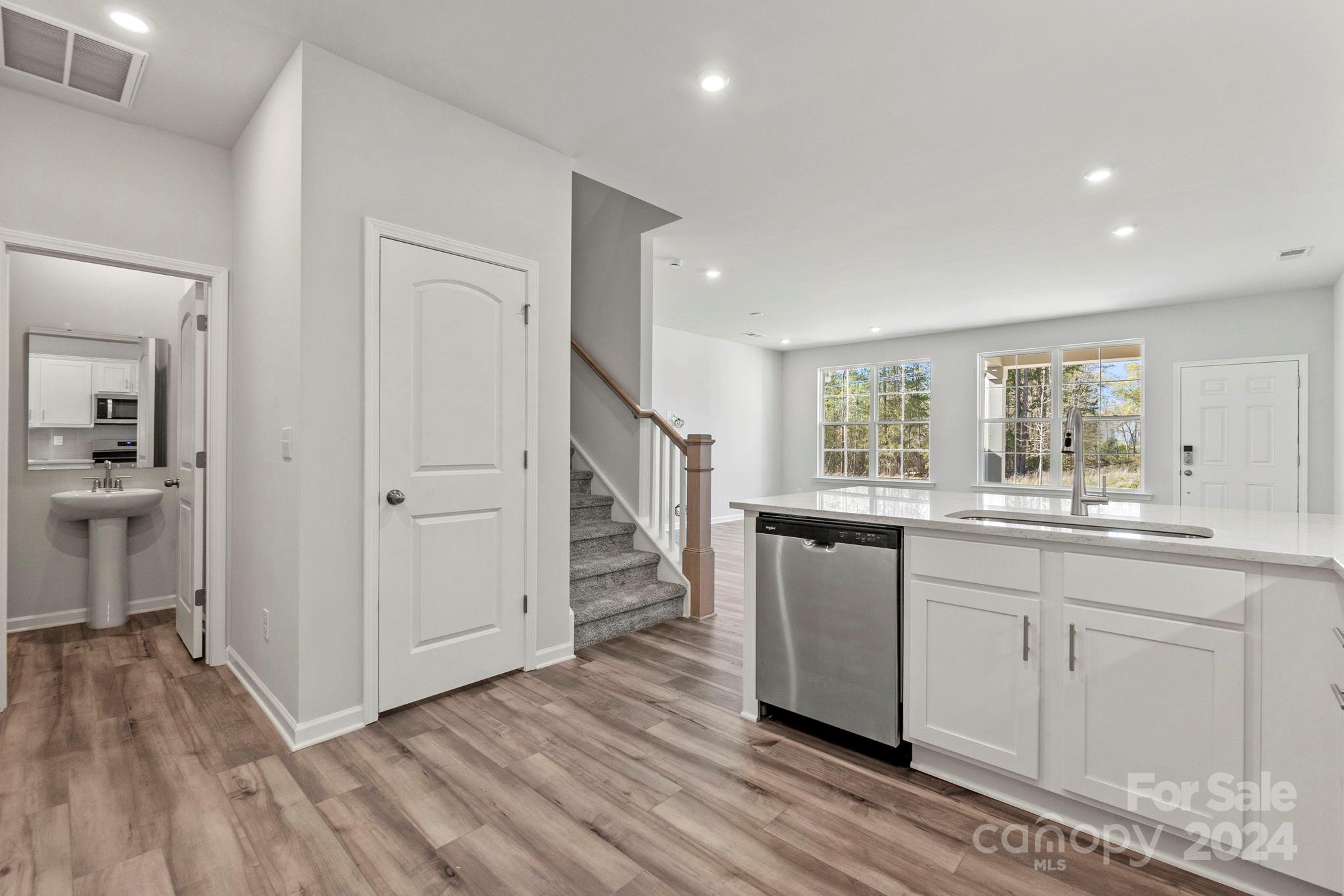 7864 Nelson Road Mint Hill, NC 28227 - Photo 27 of 45 a kitchen with a sink and wooden floor