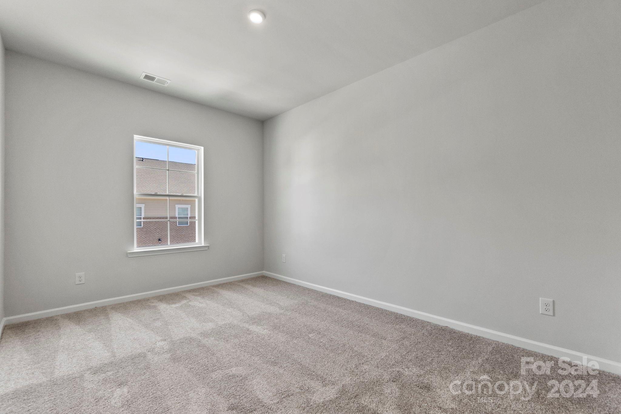 7864 Nelson Road Mint Hill, NC 28227 - Photo 35 of 45 a view of an empty room with a window