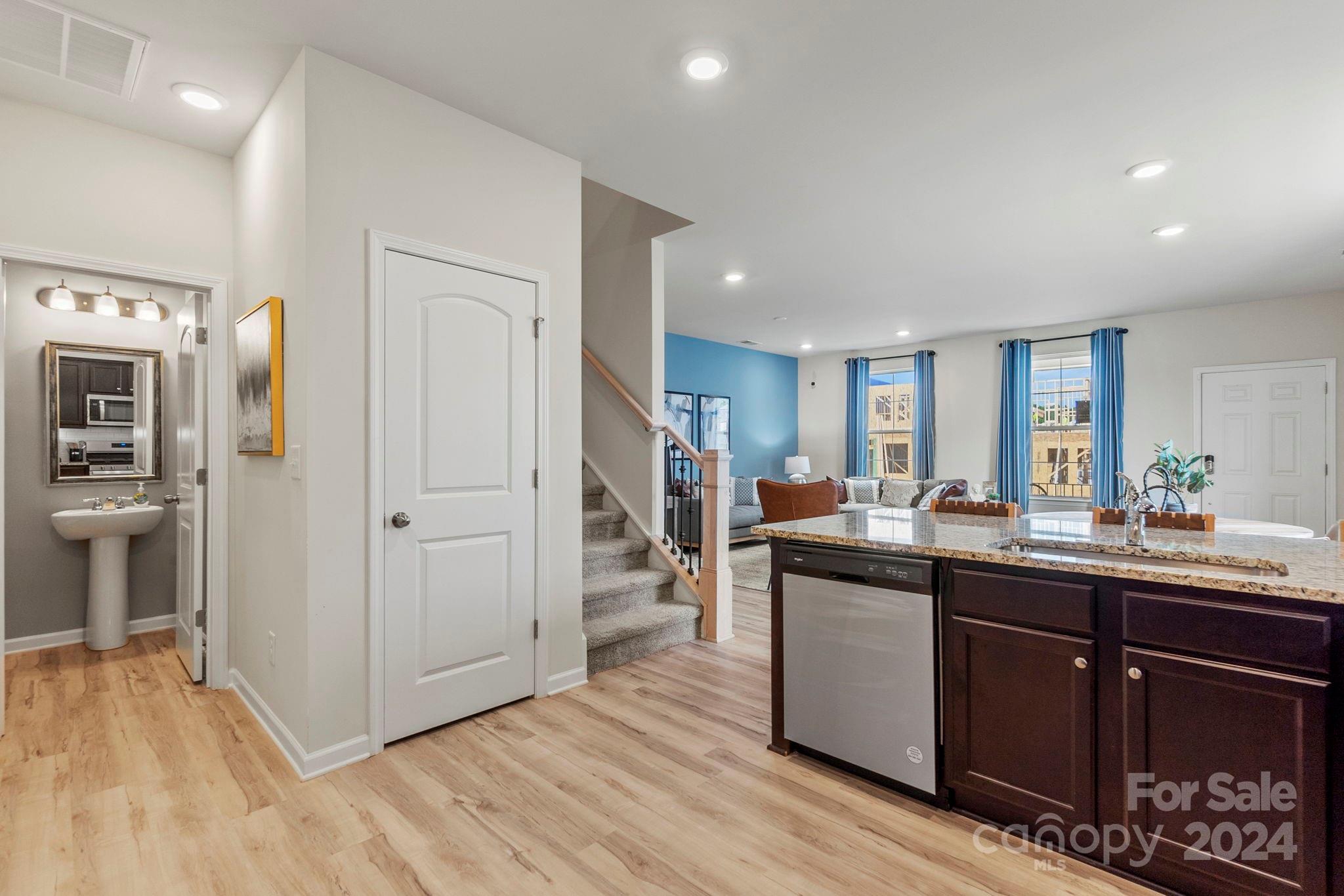 7864 Nelson Road Mint Hill, NC 28227 - Photo 10 of 45 a kitchen with stainless steel appliances granite countertop a sink and cabinets