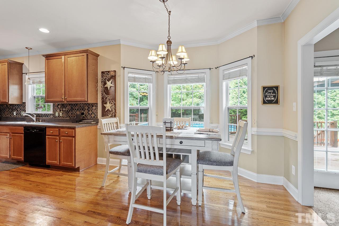 206 Kendall Drive Clayton, NC 27520 - Photo 12 of 34 a view of a dining room with furniture window and outside view
