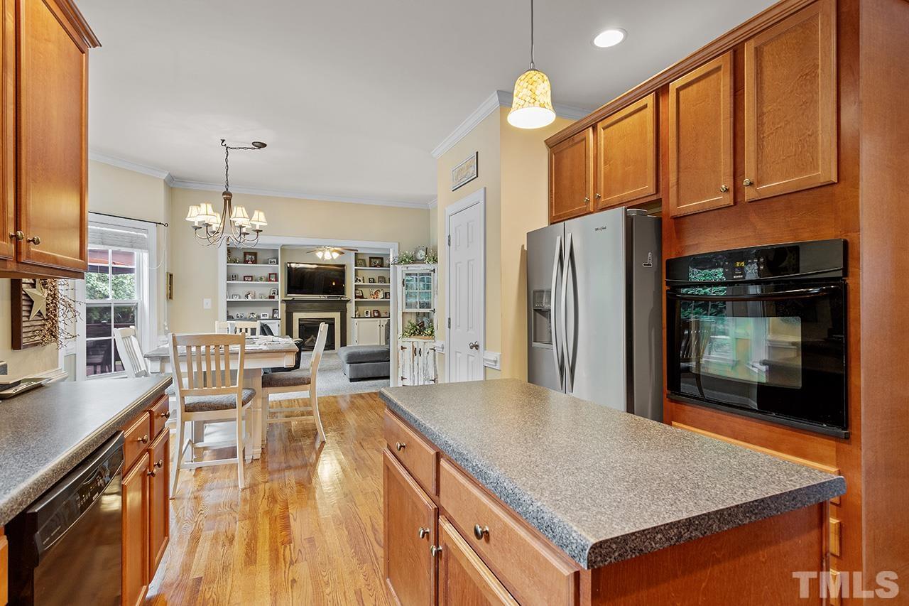 206 Kendall Drive Clayton, NC 27520 - Photo 13 of 34 a kitchen with stainless steel appliances granite countertop a stove refrigerator and microwave