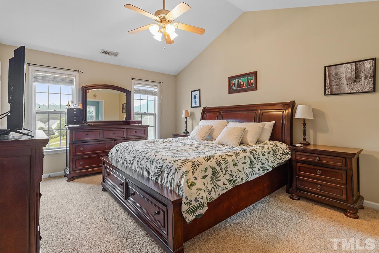 206 Kendall Drive Clayton, NC 27520 - Photo 16 of 34 a bedroom with a bed and a dresser