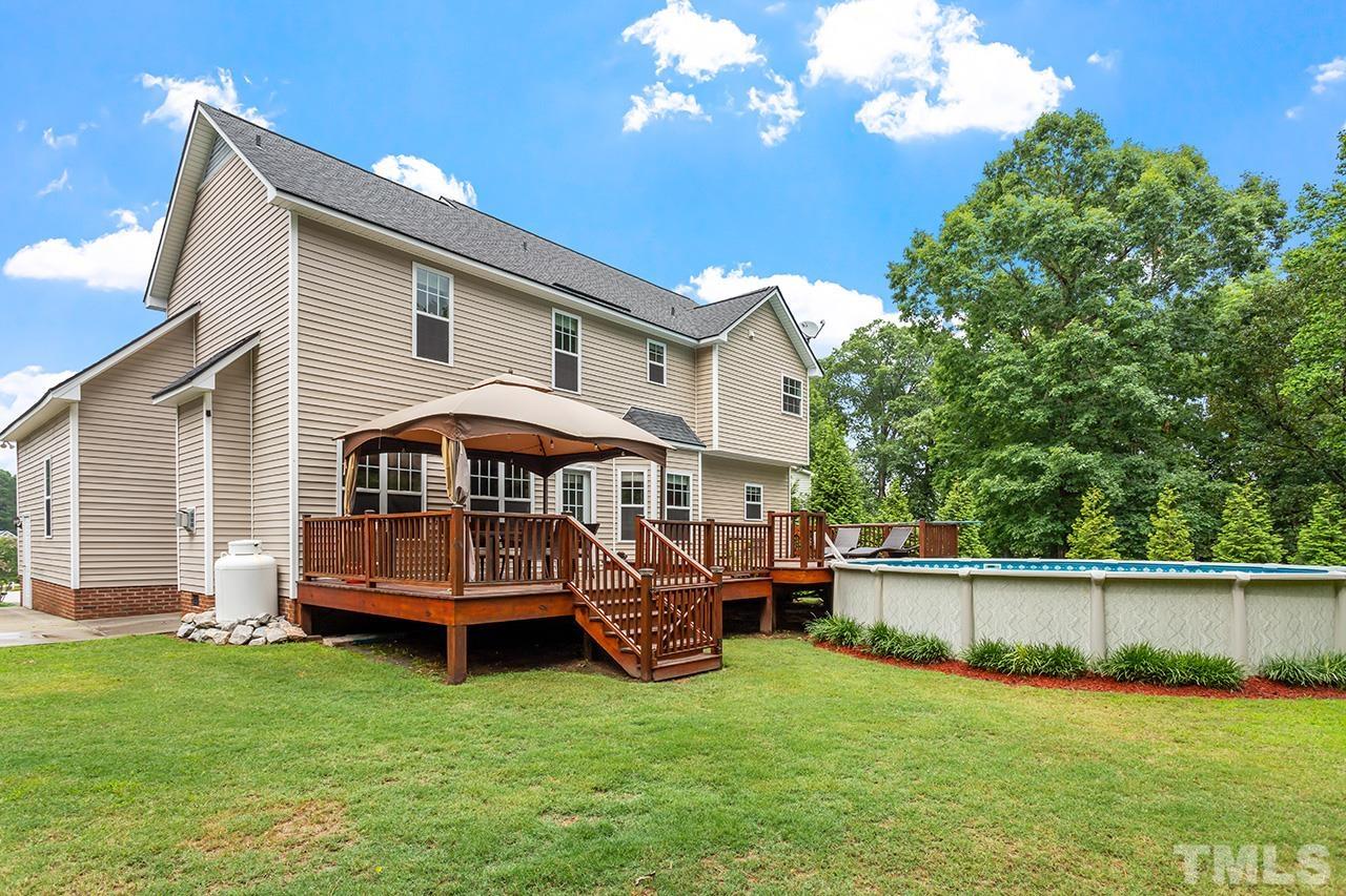 206 Kendall Drive Clayton, NC 27520 - Photo 26 of 34 a front view of a house with garden