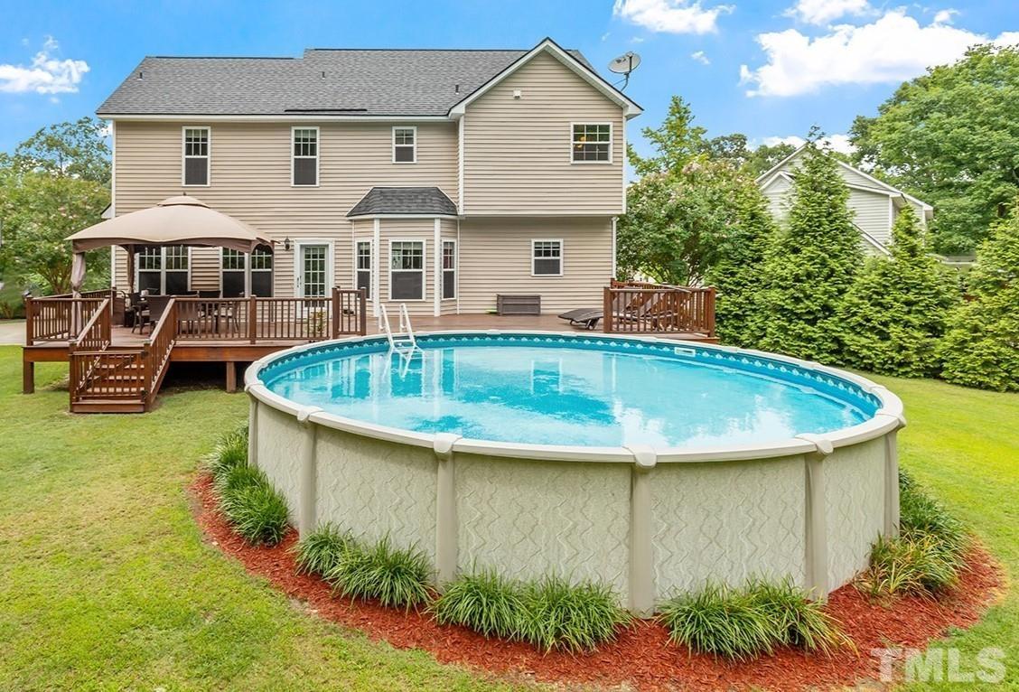 206 Kendall Drive Clayton, NC 27520 - Photo 27 of 34 a front view of house with yard and outdoor seating