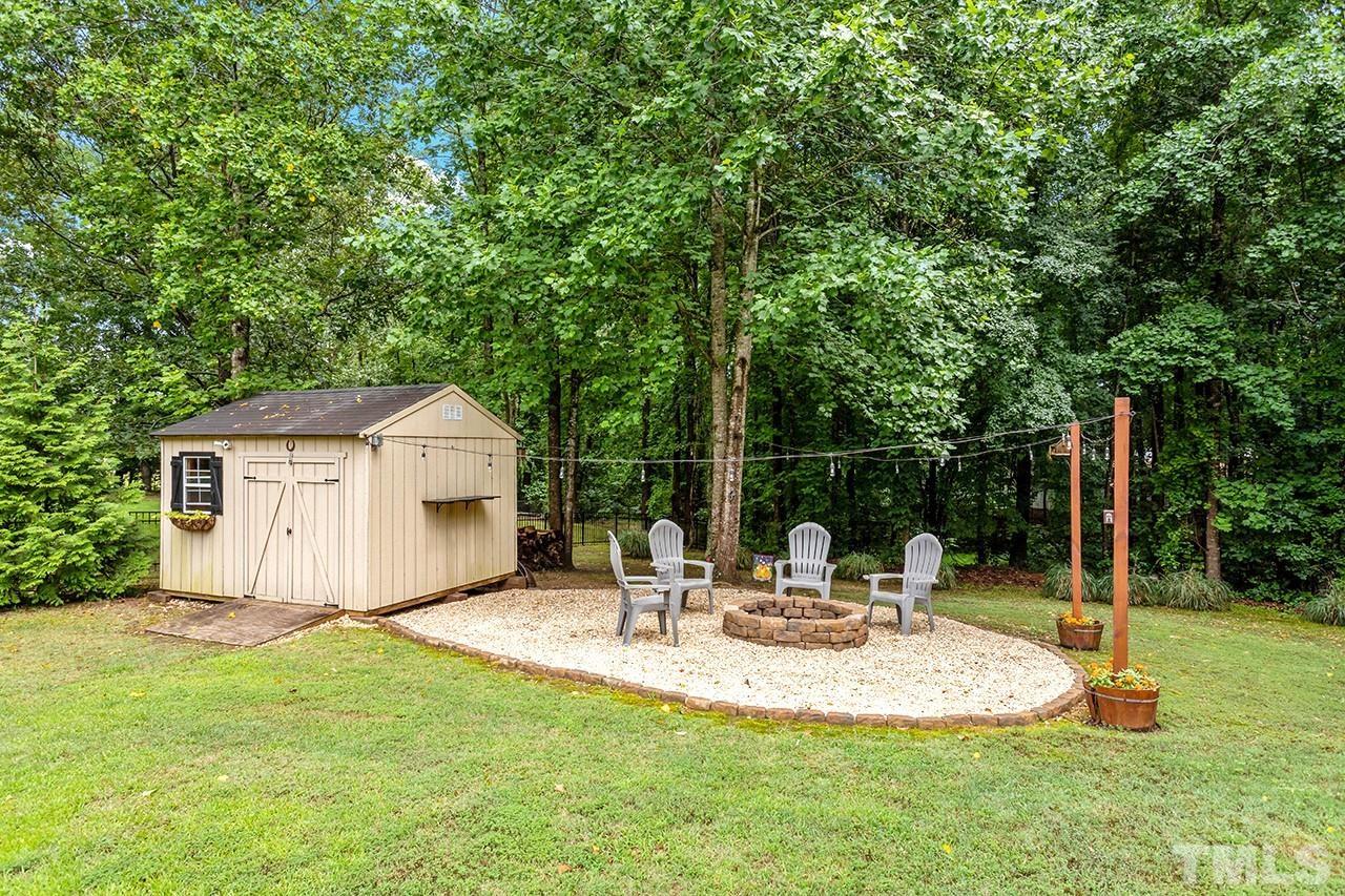 206 Kendall Drive Clayton, NC 27520 - Photo 31 of 34 a view of a chair and table in the garden