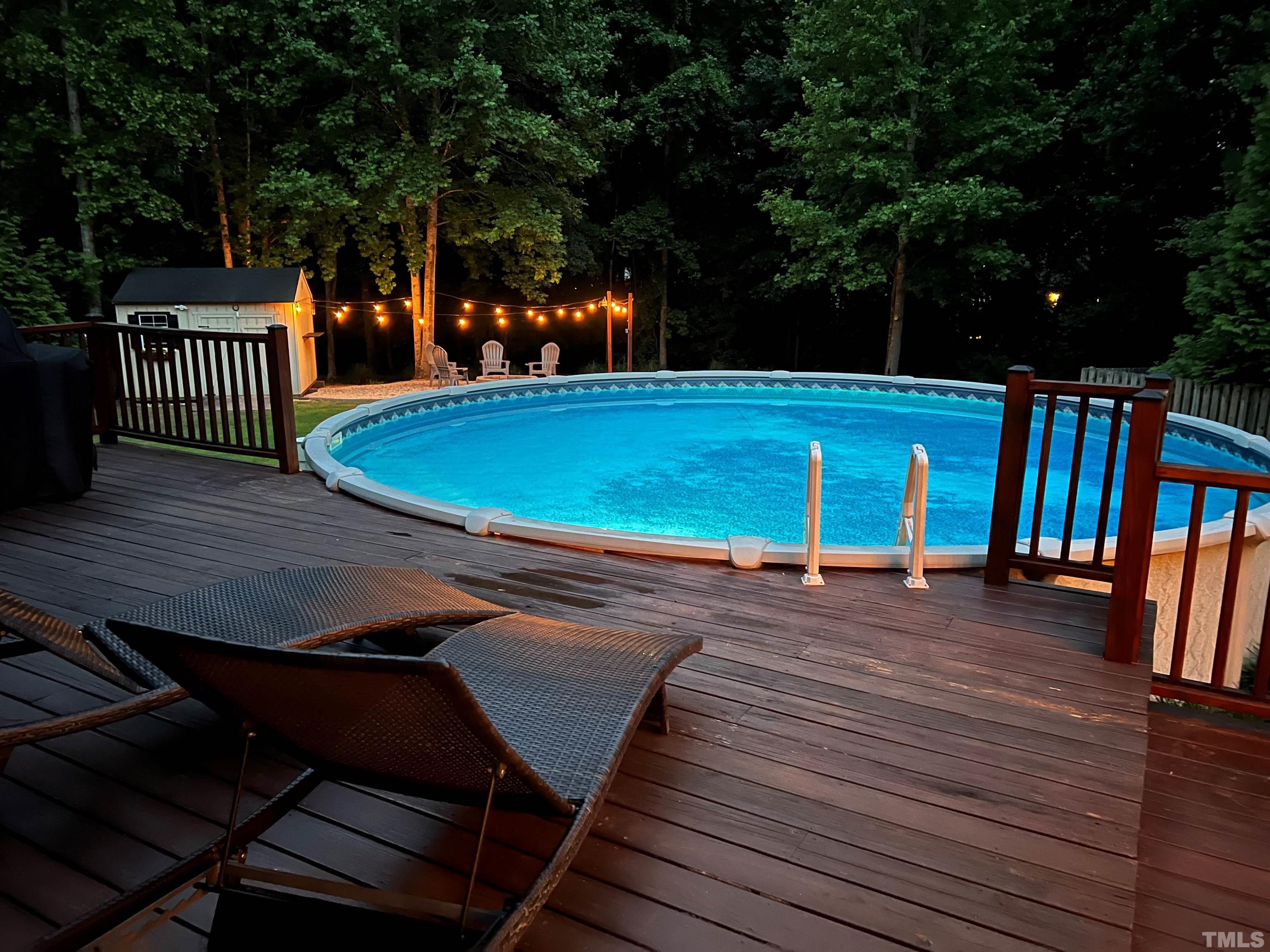 206 Kendall Drive Clayton, NC 27520 - Photo 4 of 34 a view of a swimming pool with a patio