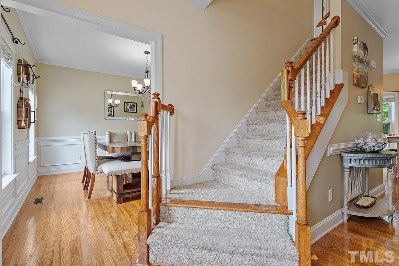 206 Kendall Drive Clayton, NC 27520 - Photo 6 of 34 a view of entryway and hall with wooden floor