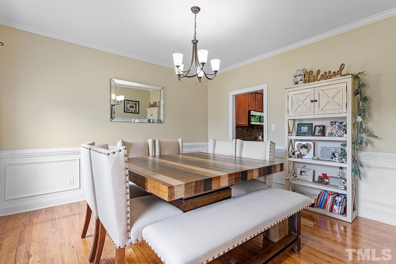 206 Kendall Drive Clayton, NC 27520 - Photo 7 of 34 a living room with furniture and a flat screen tv