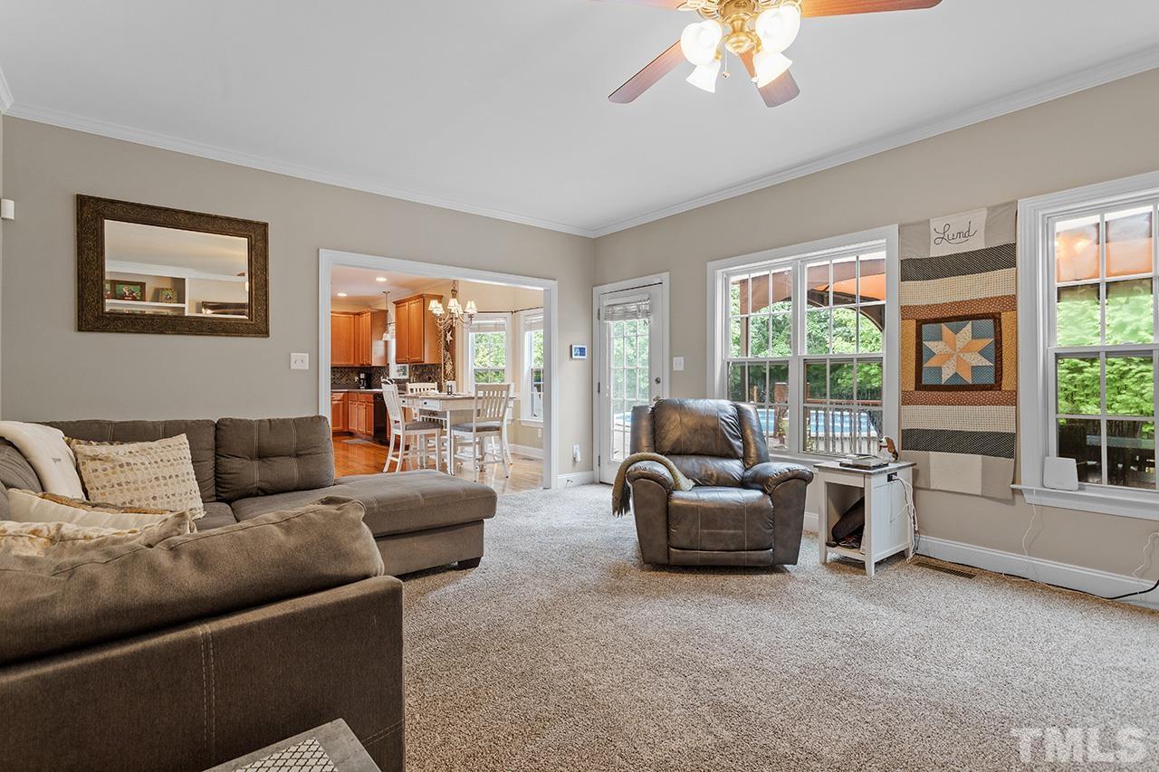 206 Kendall Drive Clayton, NC 27520 - Photo 10 of 34 a living room with furniture and a large window