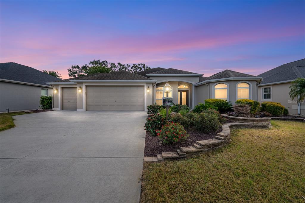 3011 Bureau Path The Villages, FL 32163 - Photo 1 of 1 a front view of a house with garden