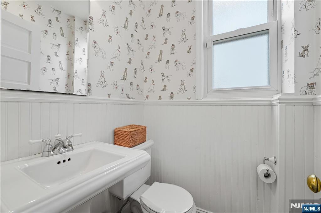 56-58 Bonn Place Weehawken, NJ 07086 - Photo 11 of 29 a bathroom with a sink and a toilet