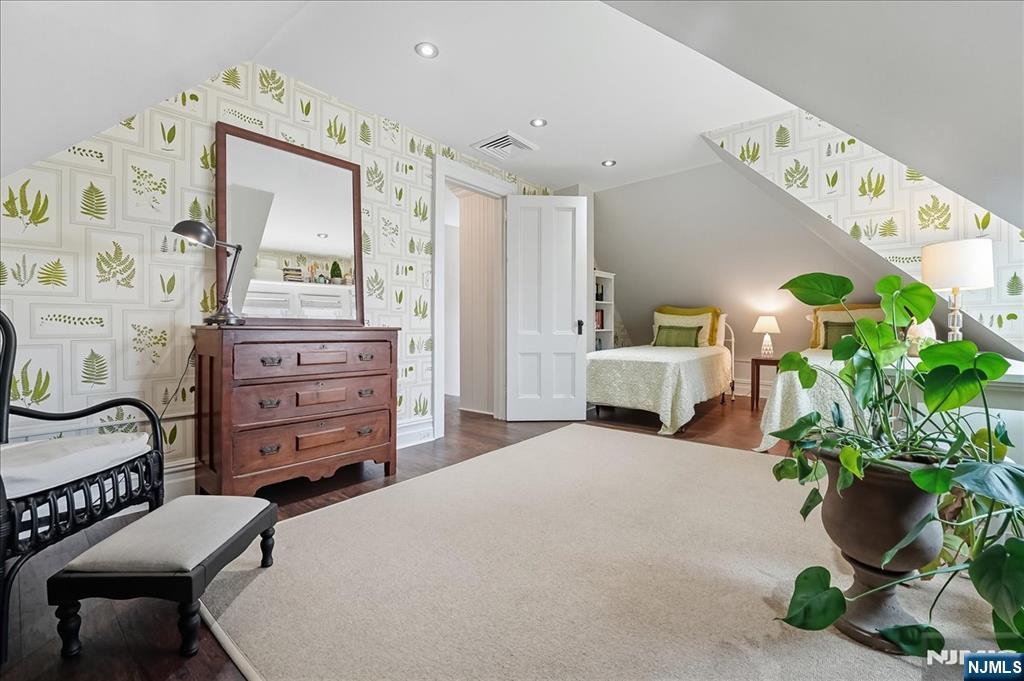 56-58 Bonn Place Weehawken, NJ 07086 - Photo 20 of 29 a bedroom with a bed and a dresser