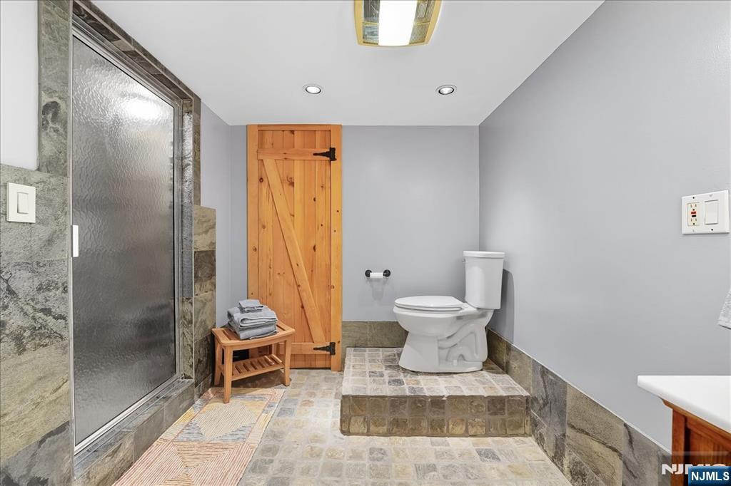 56-58 Bonn Place Weehawken, NJ 07086 - Photo 24 of 29 a bathroom with a toilet and a shower