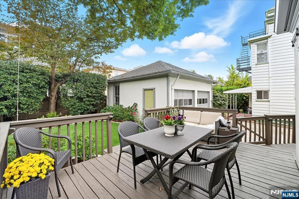 56-58 Bonn Place Weehawken, NJ 07086 - Photo 26 of 29 a view of a patio with a table and chairs