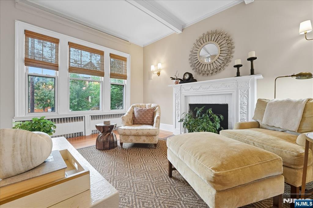 56-58 Bonn Place Weehawken, NJ 07086 - Photo 5 of 29 a bedroom with a large bed and a couch